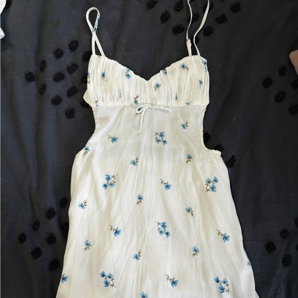 Isabelle’s Cabinet white and blue floral open back mini dress